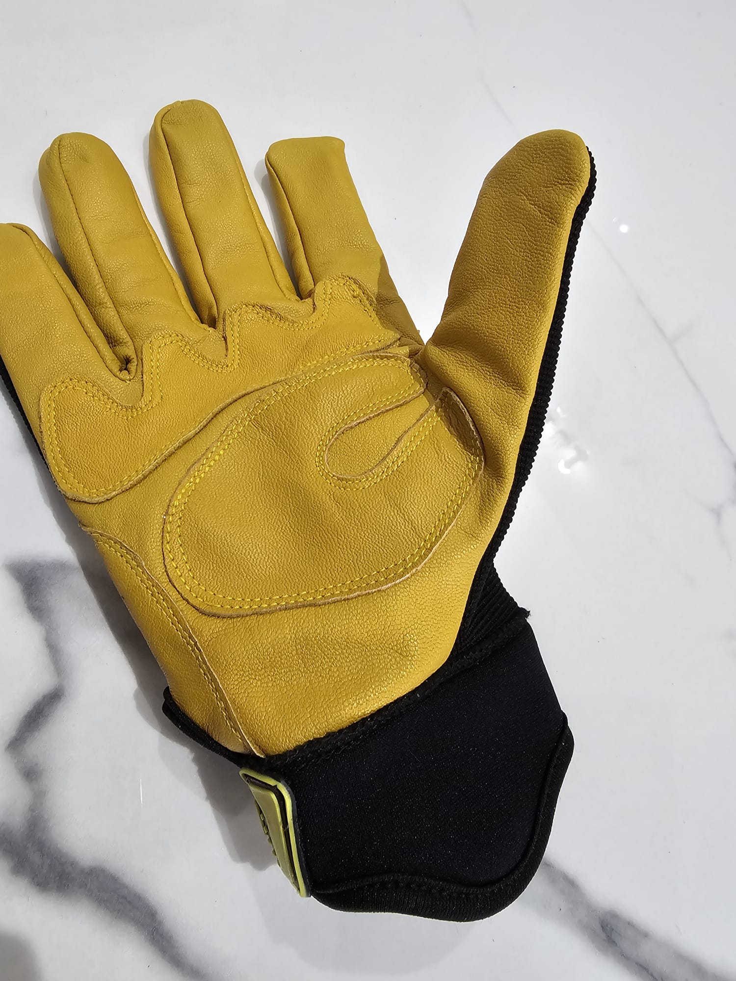 Durable and stylish Master Safety Gloves in a striking yellow and black combination, featuring Gost crust leather palms for toughness. Ideal for DIY, gardening, labor, construction, and roofing tasks, ensuring reliable hand protection during vigorous activities.